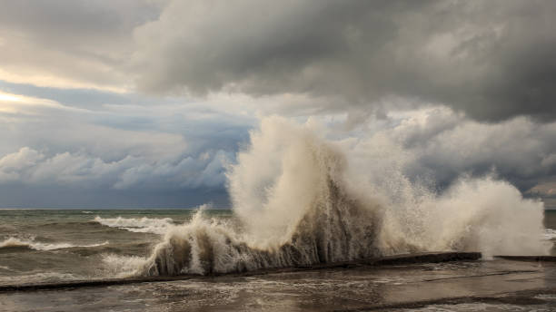 istock Storm waves over a pier in the Adler, Sochi 1130414469