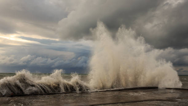 istock Storm waves over a pier in the Adler, Sochi 1130414471