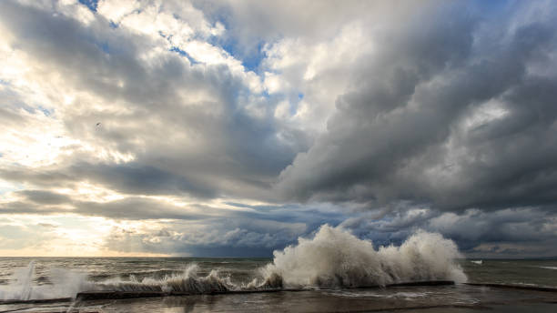 Storm waves over a pier in the Adler, Sochi