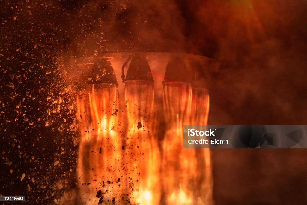 Rocket engines and fire duting the missile launch at night, close up conceptual image. Elements of this image furnished by NASA. Rocketship Stock Photo