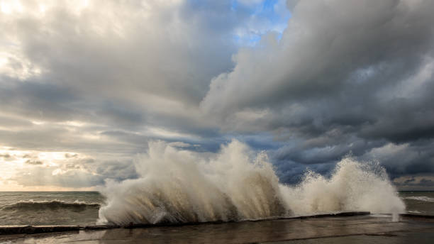 istock Storm waves over a pier in the Adler, Sochi 1130414489
