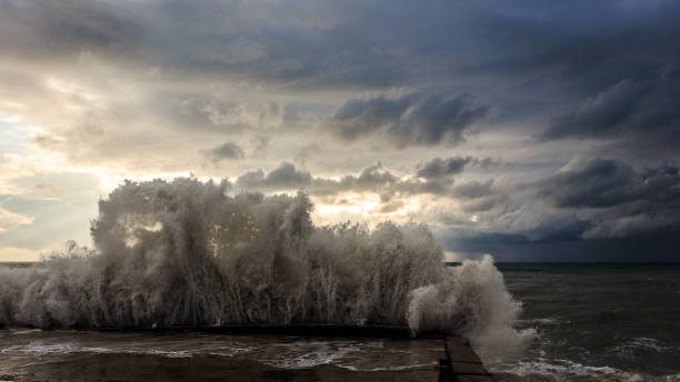 Storm waves over a pier in the Adler, Sochi