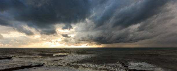 Storm waves over a pier in the Adler, Sochi