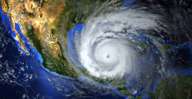 Photo of hurricane approaching the American continent visible above the Earth, a view from the satellite.