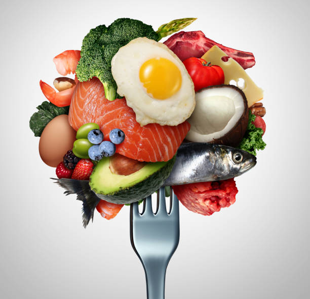 Eating Ketogenic Food Eating ketogenic food and Keto nutrition lifestyle diet low carb and high fat meal as fish nuts eggs meat avocado and other healthy ingredients as a therapeutic snacks on a fork with 3D illustration elements. omega 3 photos stock pictures, royalty-free photos & images