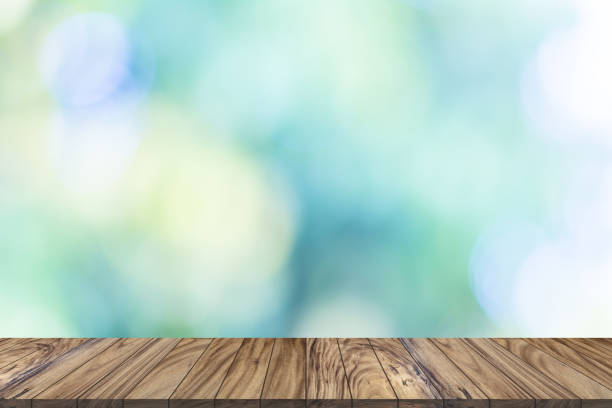 istock Wood table top perspective for product display on bokeh background 1130416103