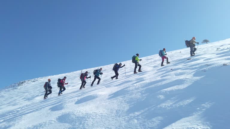 Group of climbers are walking in the mountain peak