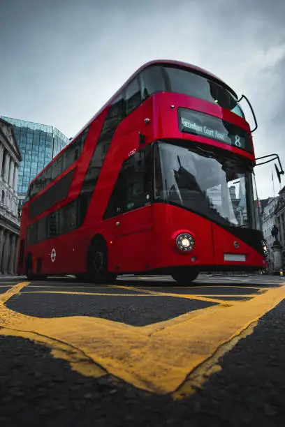 Photo of Double decker, red London bus on the move at Bank Tube Station