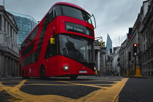 Iconic London bus making its way through the city, frozen in motion