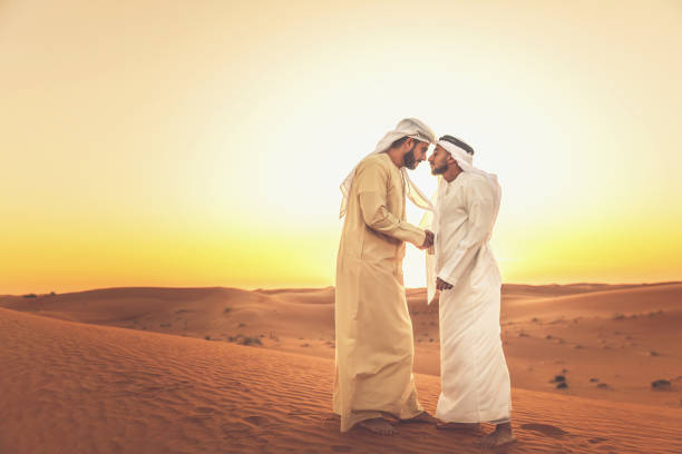 Friendship, Arab, Custom, Greeting, Culture - Two Arabs meeting at the desert, sharing a customary greeting.