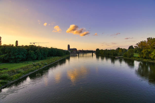 istock Sunset with river in the city 1130421090