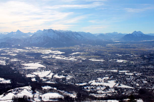 View to the south from the summit of Gaisberg near Salzburg - Watzmann, Untersberg Panoramic view over Salzburg from the Gaisberg - Sunday excursion - View towards Watzmann, Untersberg, Lattengebirge, Reiteralm, in front of it in the valley flows the Salzach - Gegenlicht gaisberg stock pictures, royalty-free photos & images