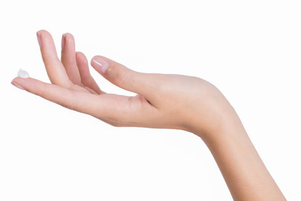 istock Woman hands with apply lotion and cream on her hand. 1130422703