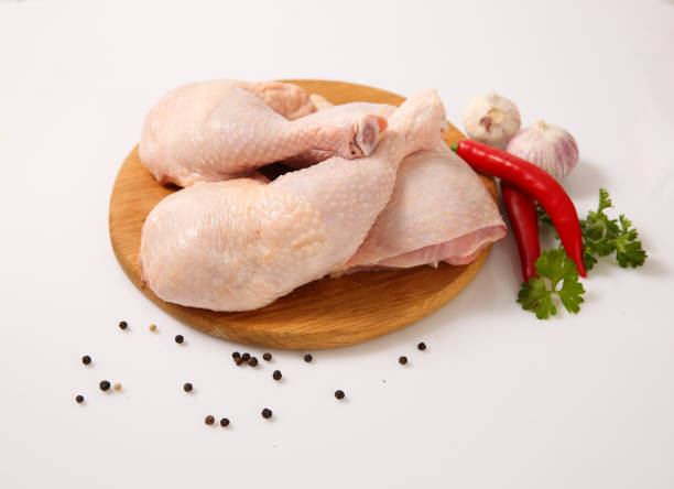 istock Pieces of raw chicken on a light background.. 1130422769