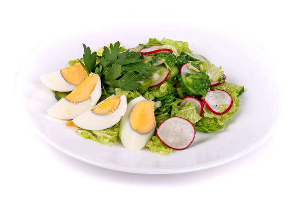 istock Salad of cucumbers, eggs and radish 1130423772