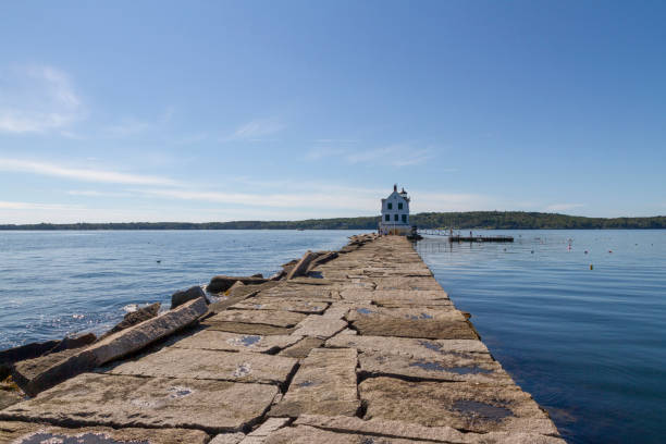 istock A cute little lighthouse on a perfect summer day 1130426583