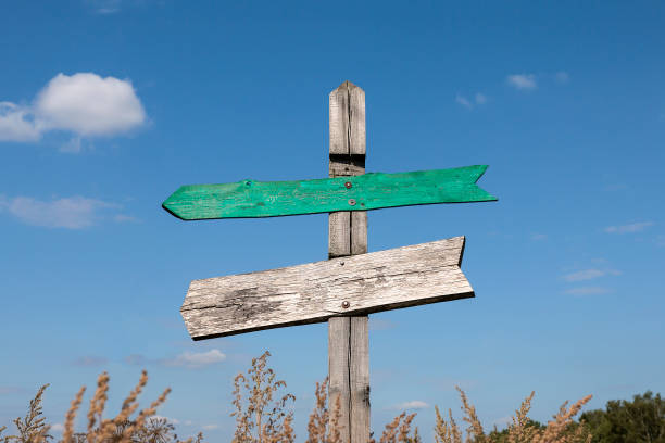 istock old wooden signpost with two arrows 1130426779