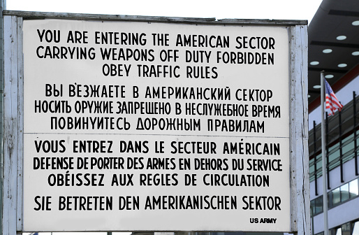 Berlin, Germany - August 20, 2017: Check Point Charlie and the sing with text in American Russian French and German Language