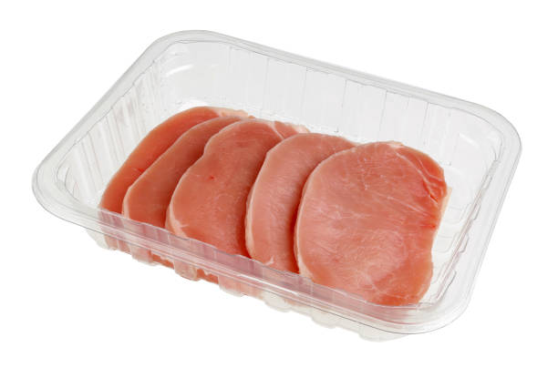 istock Fresh pork  fillet pieces  in plastic box container. Isolated 1130433450