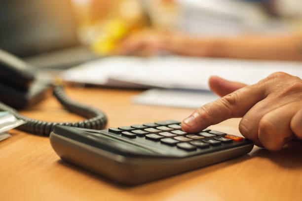 istock Close up of finger businessman using calculator calculate 1130433509