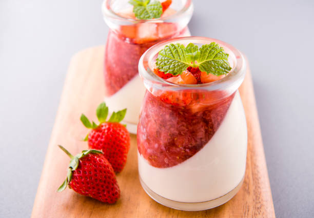 istock Delicous and nutritious double color (colour) strawberry desserts with mint and diced sarcocarp topping isolated with airy blue background, copy space, close up 1130434726