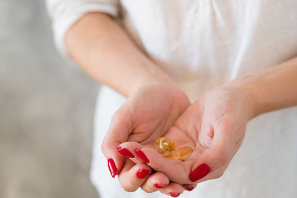 istock female health vitamin defficiency hand supplements 1130437976