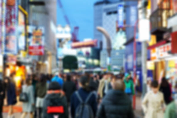 istock Blurred scene people walking in japan 1130438140