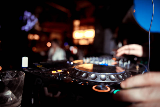 istock DJ playing music at mixer closeup 1130438756