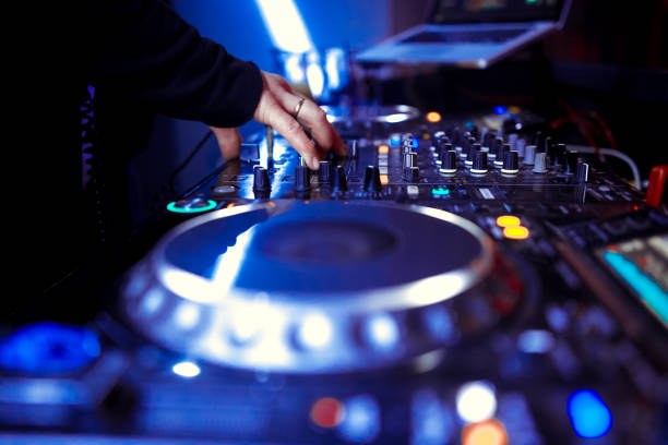 istock DJ playing music at mixer closeup 1130438816