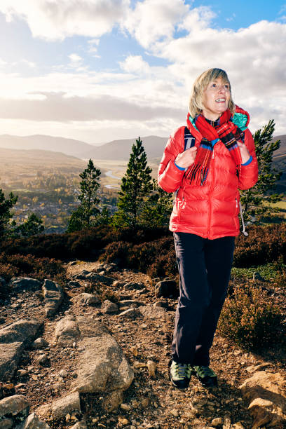 istock Female hiker on trail above Braemar, Scotland 1130439054