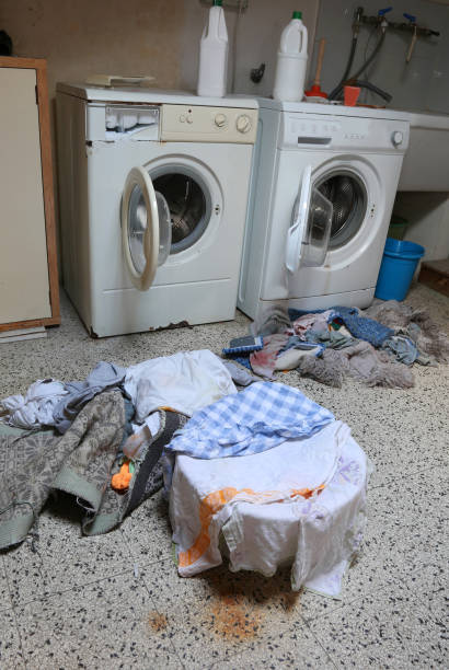 istock two washing machine in the attic with many dirty rags 1130439159