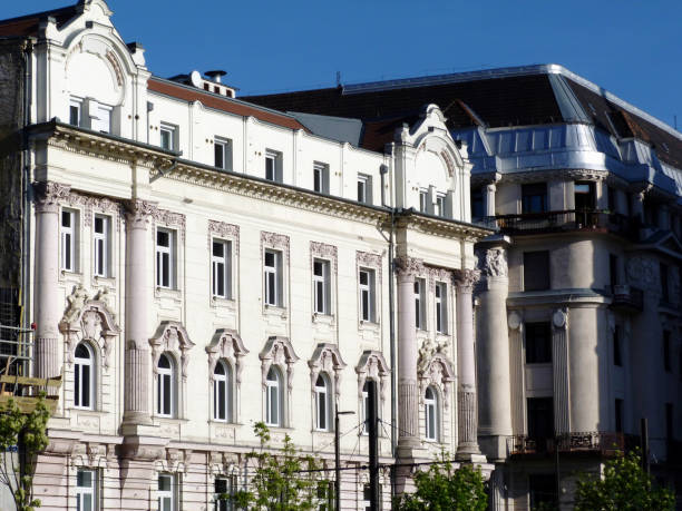istock white stucco, richly decorated old European residential building 1130439457