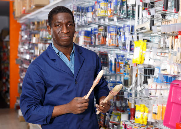 istock Nice man offering for sale different supplies 1130441232