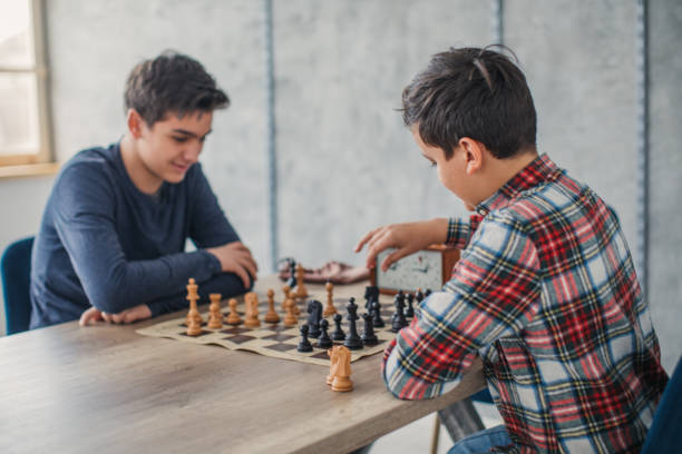 istock Smart boys playing a game of chess 1130442143