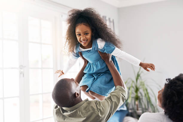 istock Mom and Dad love to make her giggle with joy 1130443135