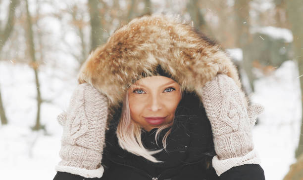 istock Beautiful blond woman in a winter parka 1130443897