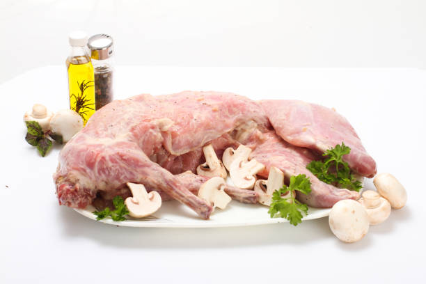 istock Rabbit meat on a wooden Board. 1130446993
