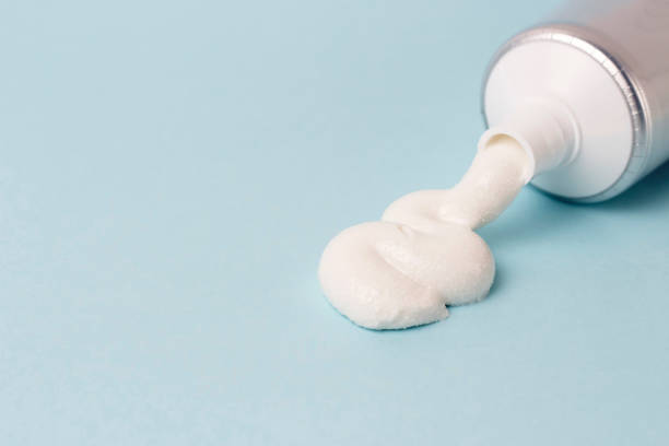 istock Toothpaste in tube on blue background. Dental hygiene concept. 1130447212