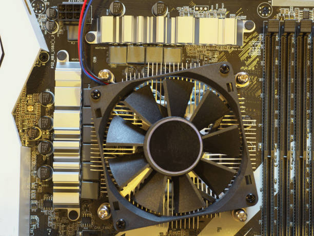 Computer motherboard with CPU cooler, radiator and fan.