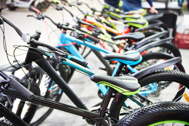 Modern bicycles in sports shop Row modern mountain bikes in sports shop bicycle shop stock pictures, royalty-free photos & images