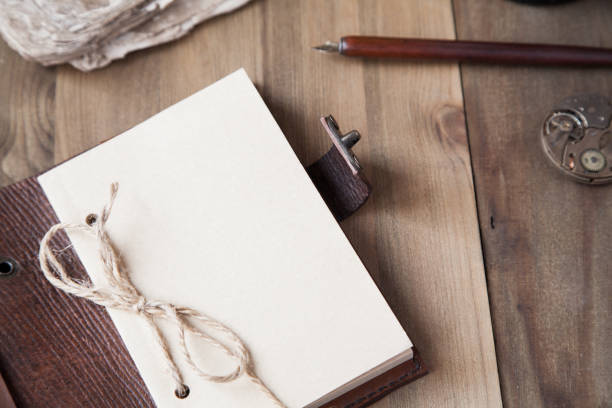 istock notepad on wooden background fountain pen old mechanical watch 1130450496