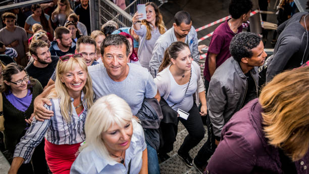istock Group of spectators entering stadium 1130450561