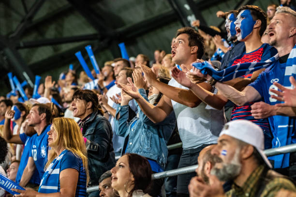 istock Group of spectators cheering in stadium 1130450570