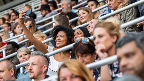 istock Group of spectators cheering in stadium 1130450571