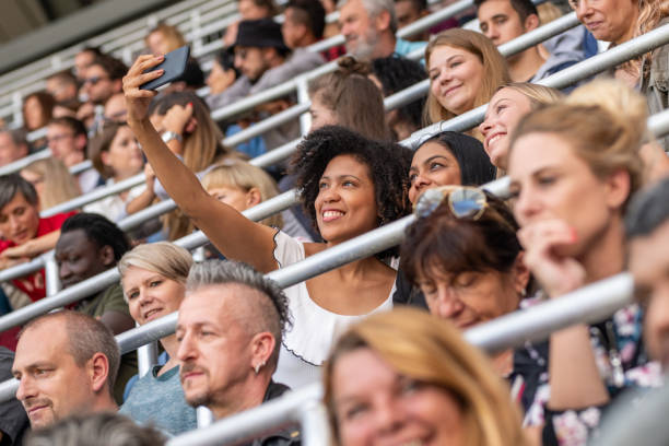 istock Group of spectators cheering in stadium 1130450573