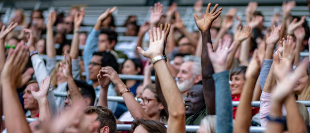 istock Group of spectators cheering in stadium 1130450577