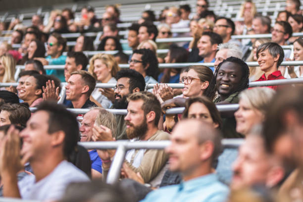 istock Group of spectators cheering in stadium 1130450581