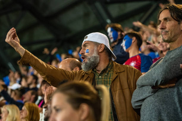 istock Group of spectators cheering in stadium 1130450582