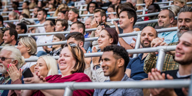 istock Group of spectators cheering in stadium 1130450583