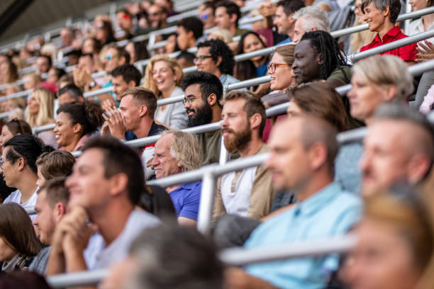 istock Group of spectators cheering in stadium 1130450584